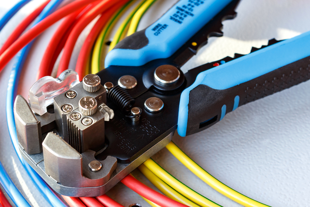 Colorful electric wires and wire cutter. | Residential Electrician Services