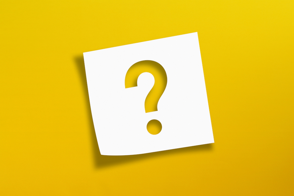 Note paper with question mark on yellow background. Electrical Products.