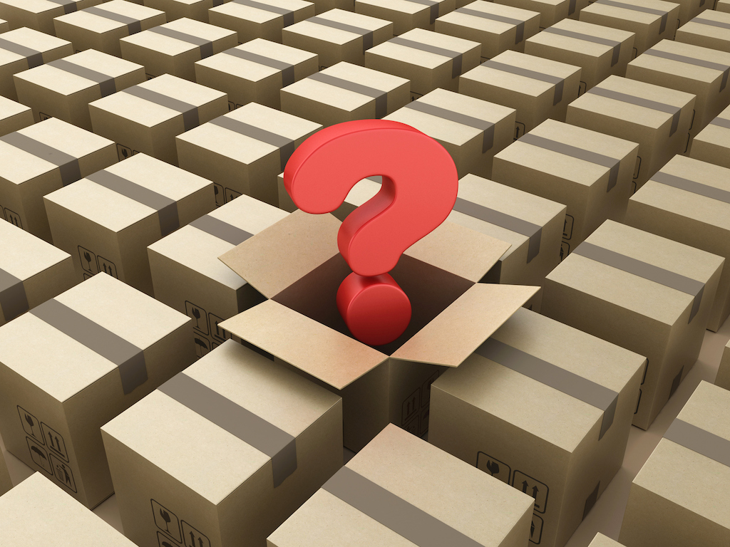 cardboard boxes with red question mark popping out of one. Representing FAQs about a generator. 